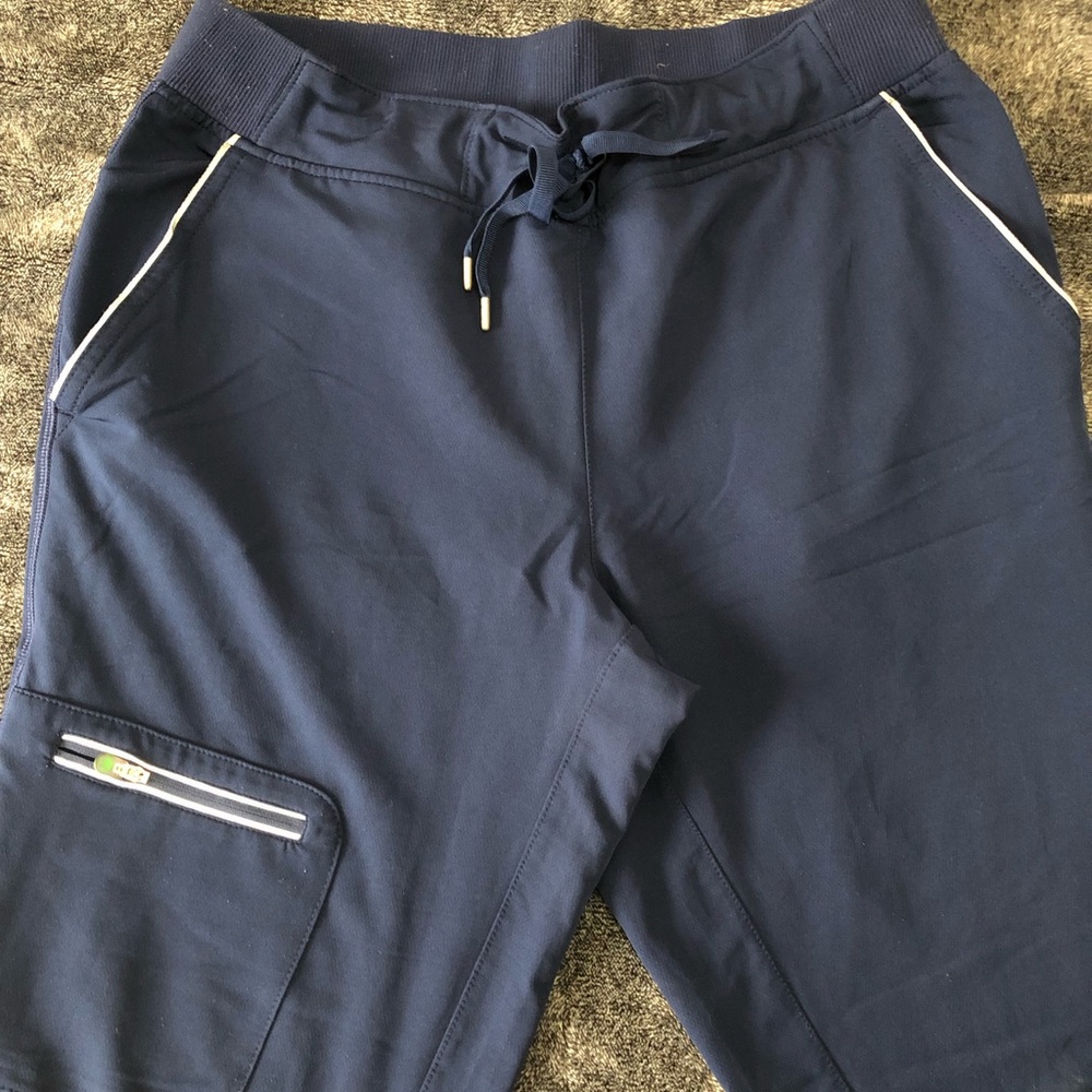 Worn once - needed longs, measures 30-31 inseam- healing hands navy bottoms